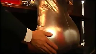 girl in shiny machine pegging business guy
